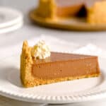 Slice of no bake Nutella cheesecake with whipped cream.
