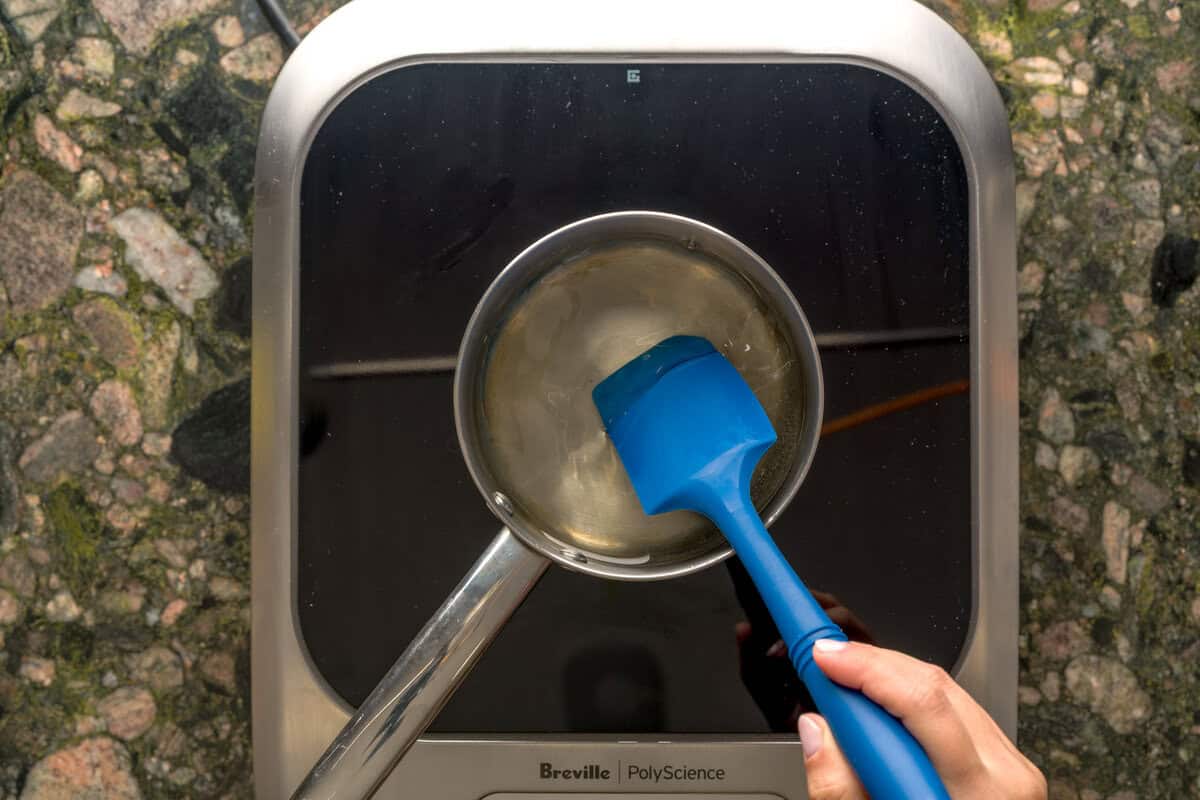 Overhead shot of simple syrup on cooktop.