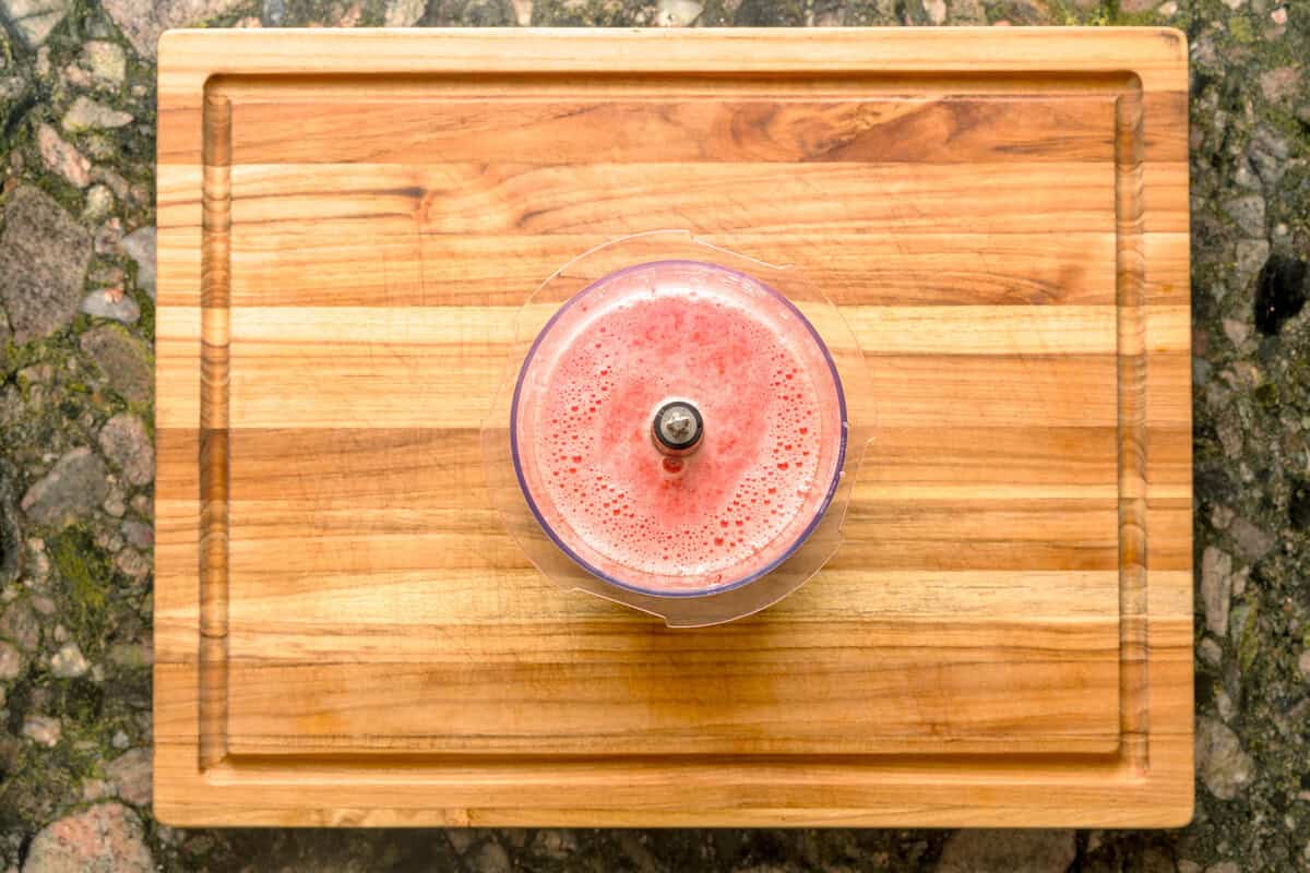 Overhead shot of blended strawberries and lemon for strawberry basil lemonade.