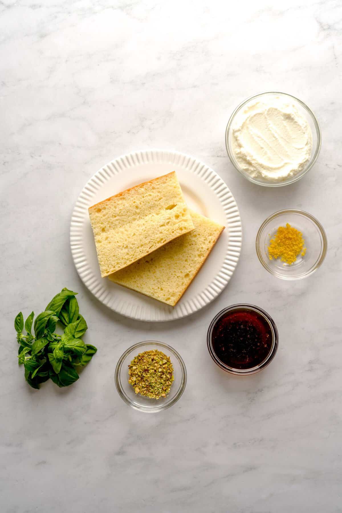 Overhead shot of the ingredients needed to make basil-lemon ricotta toast.
