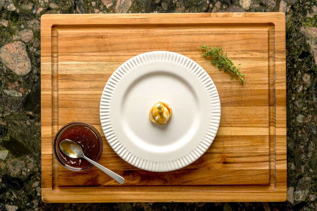 Overhead shot of assembled crostini with whipped ricotta and truffle honey.