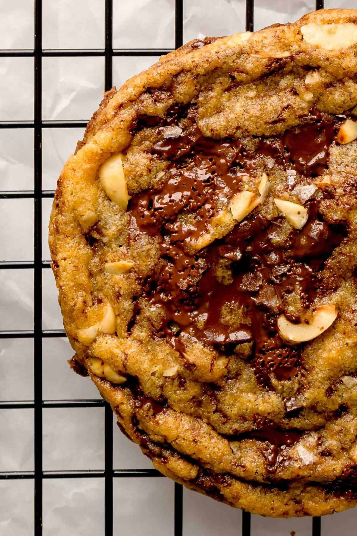 Holiday hazelnut dark chocolate cookies with brown butter on a cooling rack.