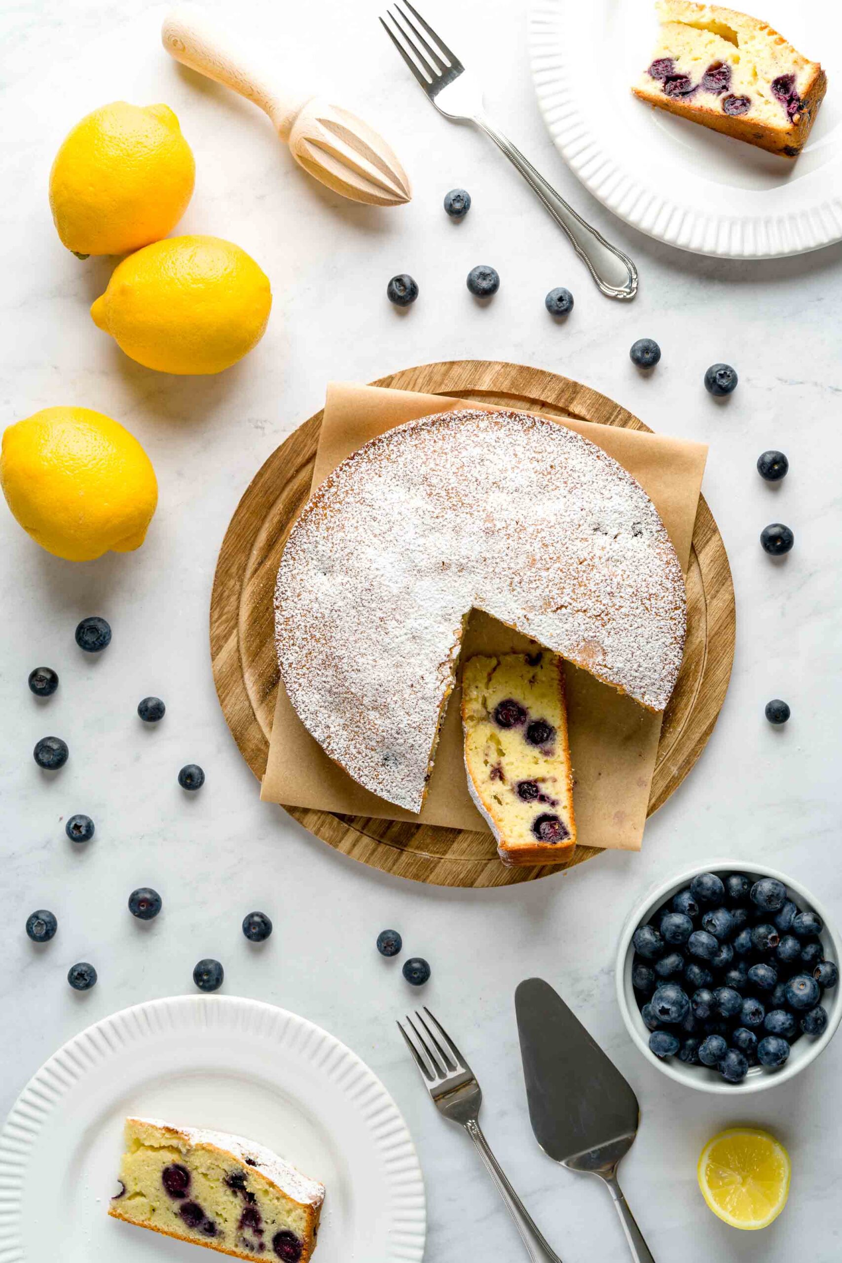 Plated slices of homemade lemon blueberry cake with olive oil.