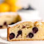 Italian olive oil cake slice with lemon and blueberries.