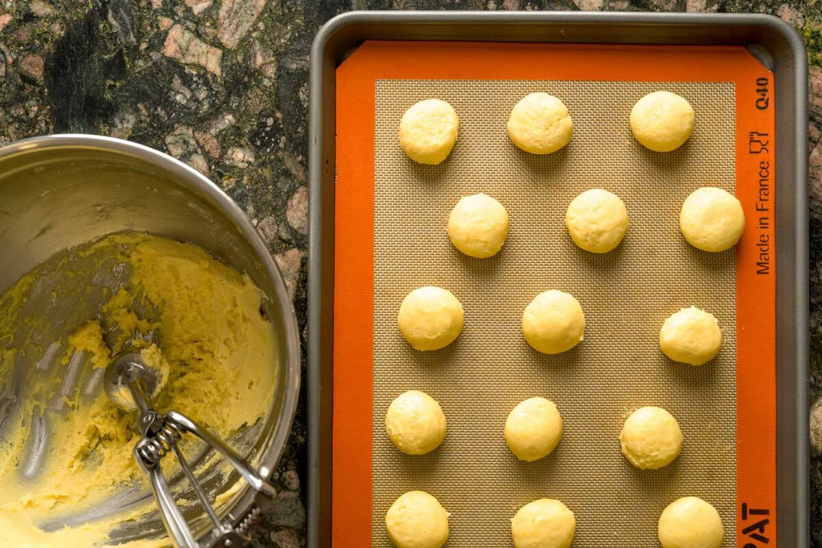 Soft and tangy lemon ricotta cookie dough on a baking sheet.