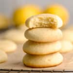 Soft lemon ricotta cookies stacked on top of one another.