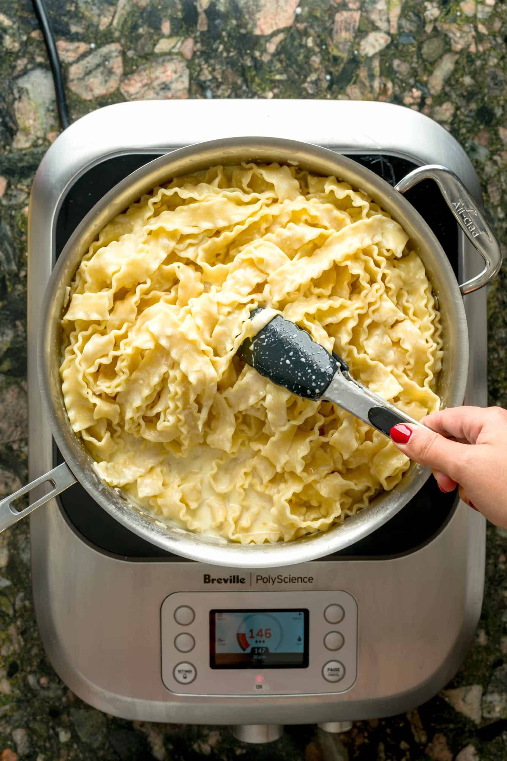 Marrying pasta and creamy lemon sauce.