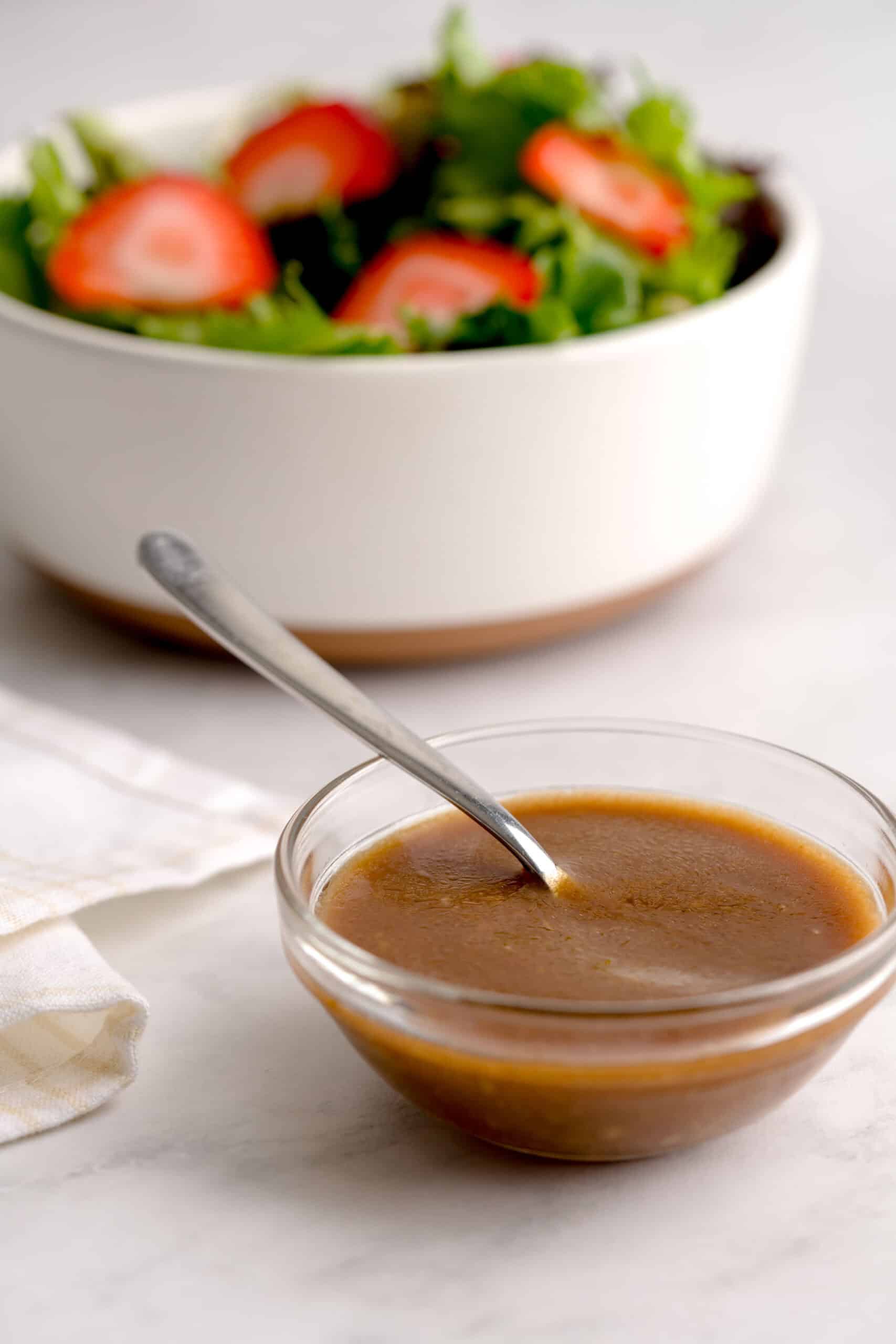 Homemade balsamic vinaigrette in a small bowl.