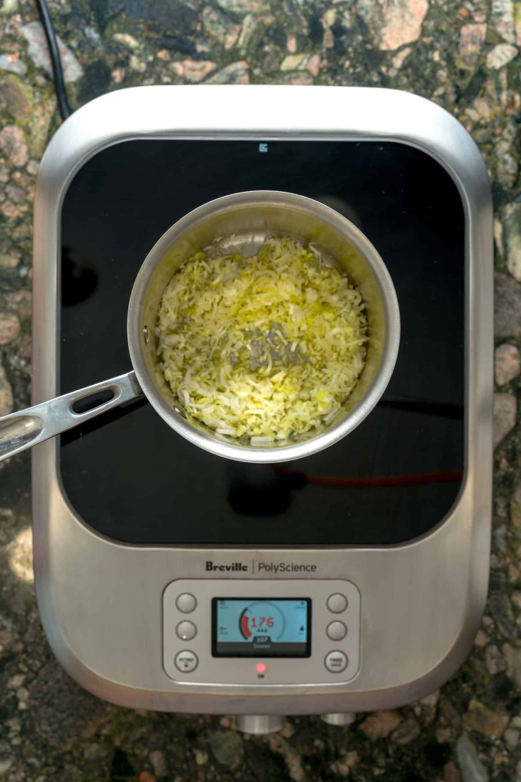 Sautéing leeks for creamy one-pot pastina.