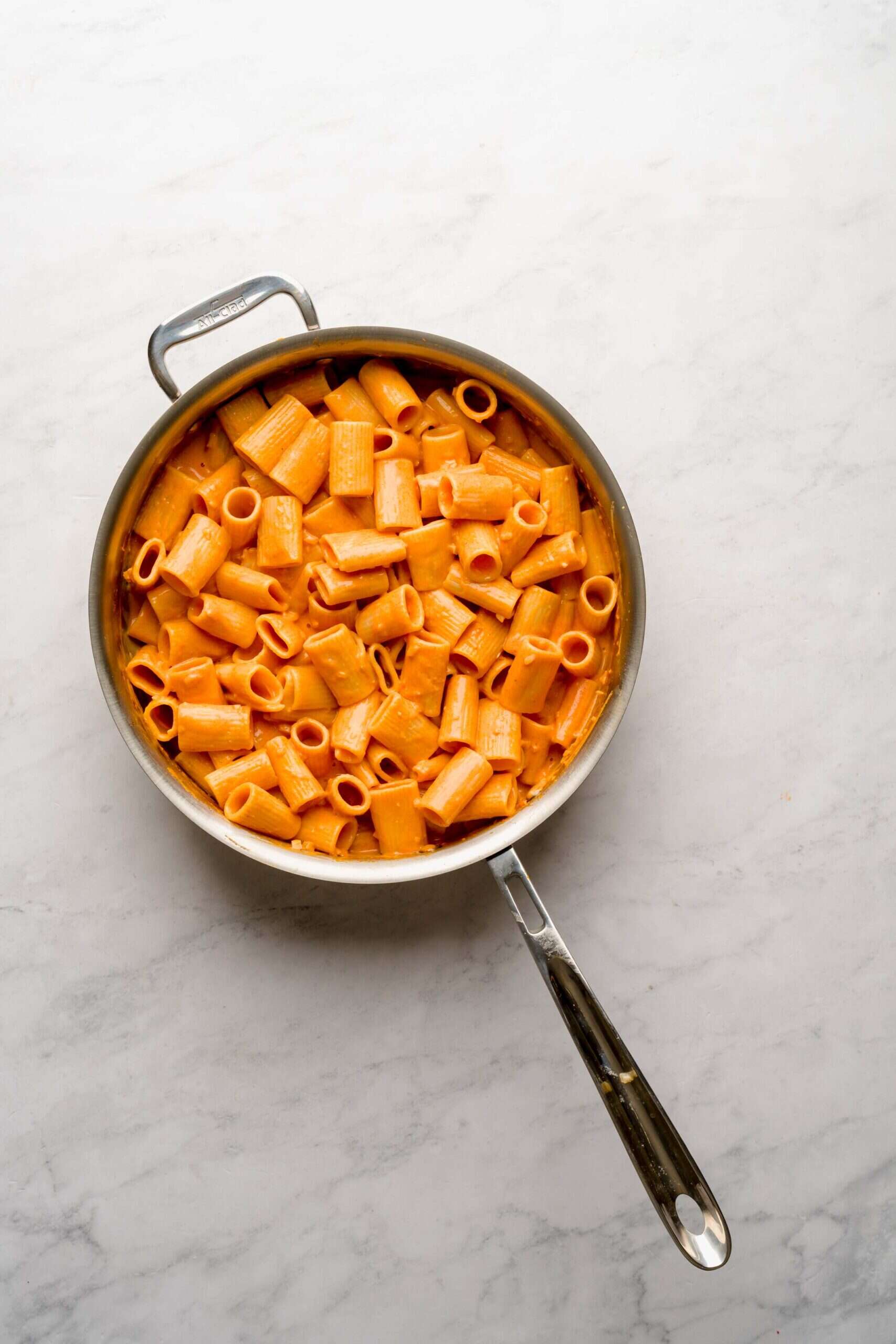 Large pan of pasta with vodka sauce.